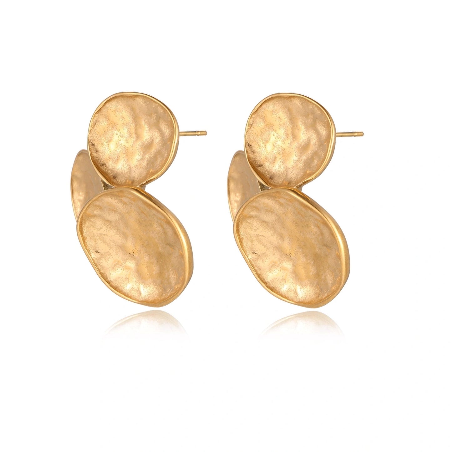 Three hammered gold discs clustered together forming organic statement earrings with textured surfaces