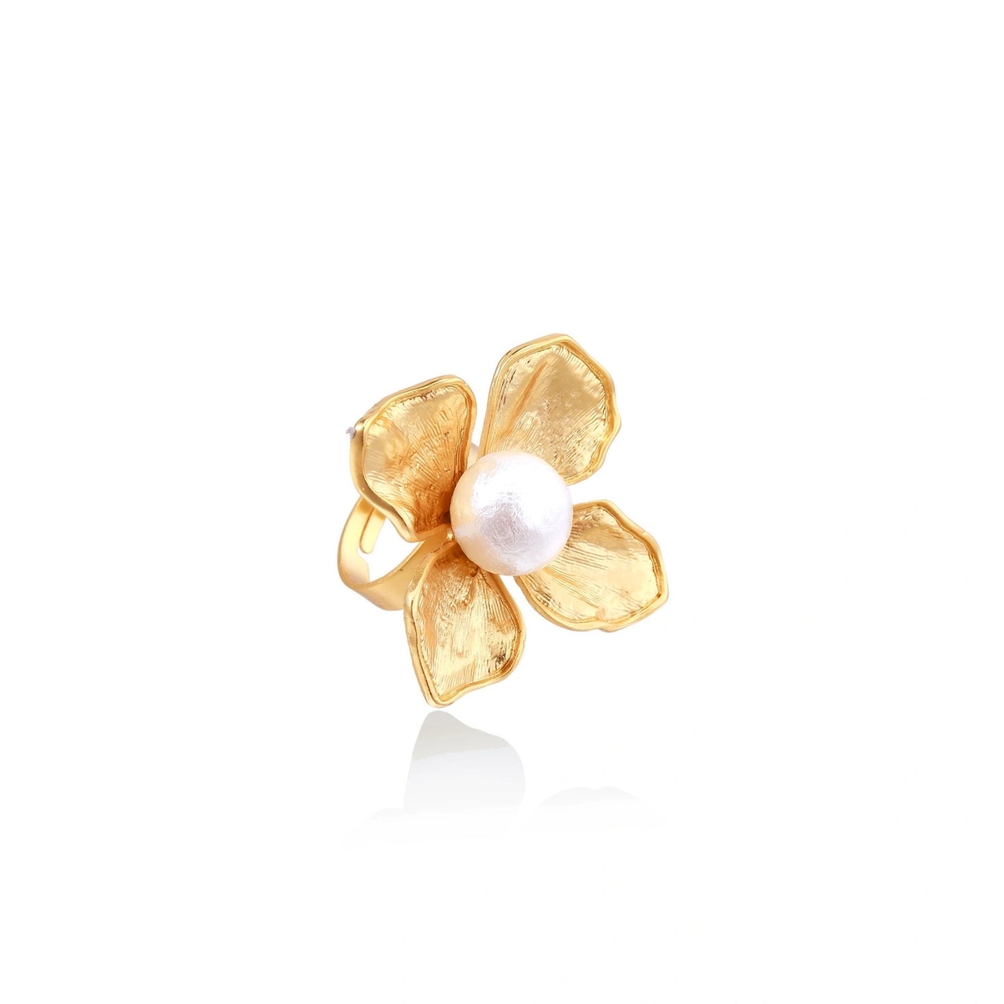 Gold-plated flower ring with textured petals and white cotton pearl center on cream background