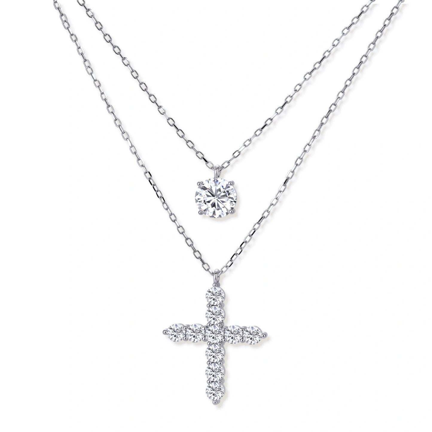 Two delicate sterling silver necklaces with moissanite stones - one solitaire pendant and one cross pendant on white background.