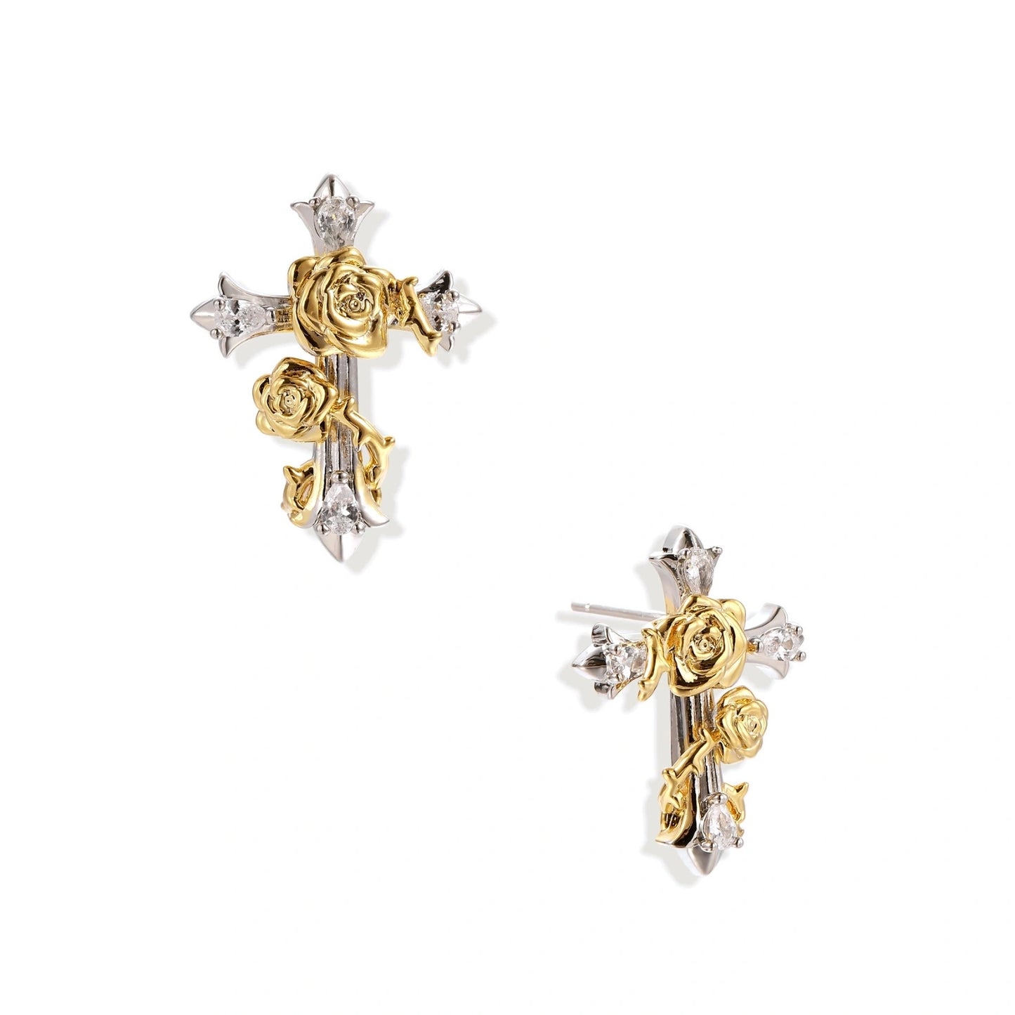 Gold-plated cross earrings with dimensional roses and crystal details on cream background, 18k gold over brass construction.
