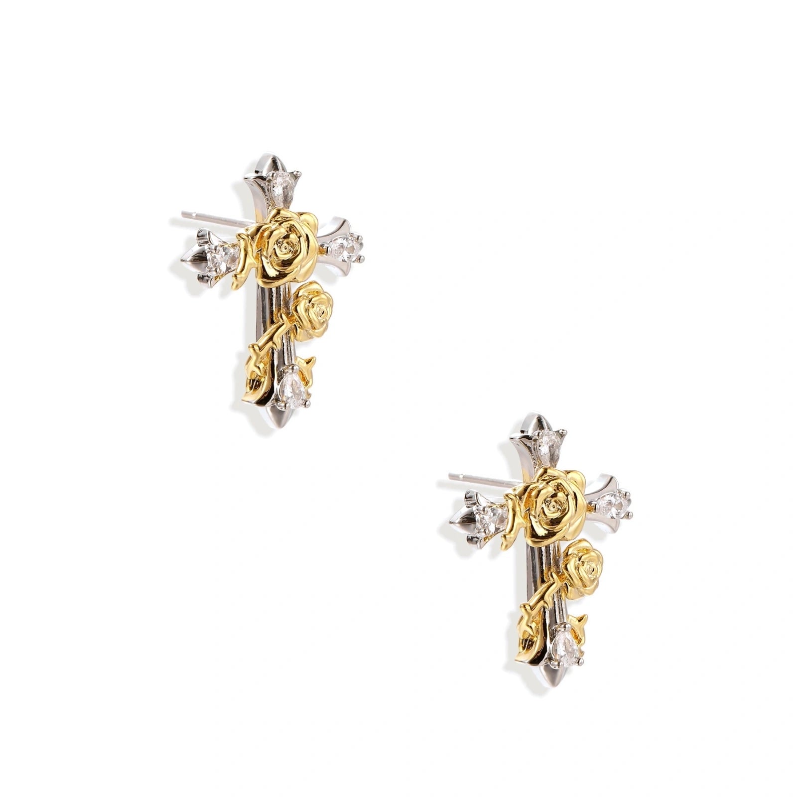 Gold-plated cross earrings with dimensional roses and crystal details on cream background, 18k gold over brass construction.
