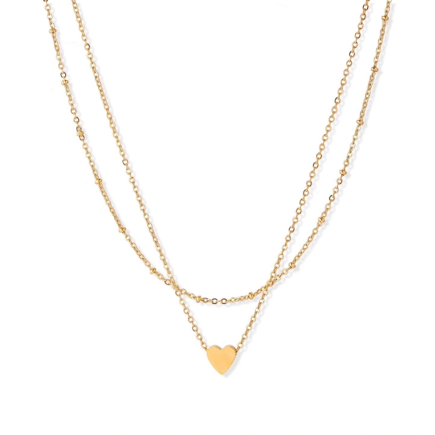 Delicate double-chain gold necklace with tiny heart pendant on cream background