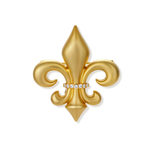 Ornate gold-plated fleur-de-lis brooch with crystal band detail on white background, showing brushed metal finish.